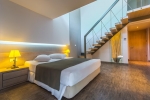Кровать или кровати в номере Akti Palace Hotel
