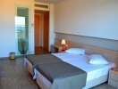 Кровать или кровати в номере Akti Palace Hotel