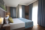 Кровать или кровати в номере Selectum Family Resort