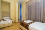 Кровать или кровати в номере Hotel Aliko