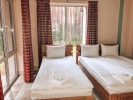 Кровать или кровати в номере Ислочь-Парк