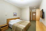A bed or beds in a room at Health Resort Plissa