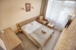 A bed or beds in a room at Sanatory Yunost