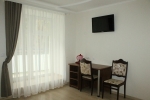 A television and/or entertainment centre at Zhemchuzhina Health Resort