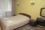 A bed or beds in a room at Zhemchuzhina Health Resort