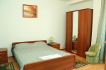 Кровать или кровати в номере Санаторий Сосны на озере Нарочь