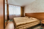 Кровать или кровати в номере Sanatorii Raduga