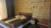 Кровать или кровати в номере Санаторий Лесные озера
