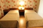 Кровать или кровати в номере Санаторий «Жемчужина»
