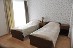 Кровать или кровати в номере Санаторий «Жемчужина»