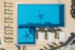 Вид на бассейн в Nostos Beach Boutique Hotel или окрестностях