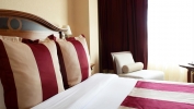 A bed or beds in a room at Crowne Plaza - Minsk