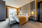 A bed or beds in a room at DoubleTree by Hilton Minsk