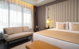 A bed or beds in a room at DoubleTree by Hilton Minsk