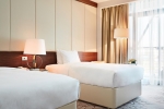 Кровать или кровати в номере Renaissance Minsk Hotel 