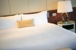 Кровать или кровати в номере Renaissance Minsk Hotel 