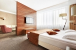 A bed or beds in a room at Victoria Olimp Hotel & Business centre Minsk