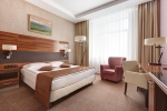 A bed or beds in a room at Victoria Olimp Hotel & Business centre Minsk