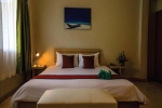 Кровать или кровати в номере Simply Resort