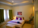 Кровать или кровати в номере Simply Resort