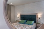Кровать или кровати в номере Mareblue Beach