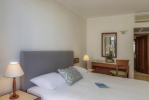 Кровать или кровати в номере Mitsis La Vita Beach Hotel
