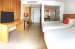 Кровать или кровати в номере Welcome Jomtien Beach Hotel