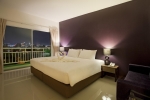 Кровать или кровати в номере Wiz Hotel