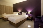 Кровать или кровати в номере Wiz Hotel
