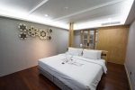 Кровать или кровати в номере Andaman Cannacia Resort & Spa