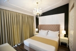 Кровать или кровати в номере Hotel Flower & SPA