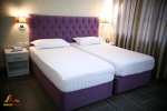 Кровать или кровати в номере Fafa Premium Hotel