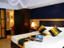 Кровать или кровати в номере Diamond Cottage Resort & Spa