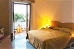 Кровать или кровати в номере Hotel “Vila Bregdeti”