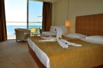 Кровать или кровати в номере Amara Centro Resort