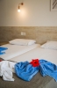 Кровать или кровати в номере Panthea Holiday Village Water Park Resort