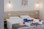Кровать или кровати в номере Panthea Holiday Village Water Park Resort