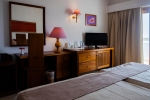 Кровать или кровати в номере The Orangers Beach Resort and Bungalows