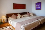 Кровать или кровати в номере The Orangers Beach Resort and Bungalows