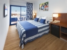 Кровать или кровати в номере Hotel Tahití Playa