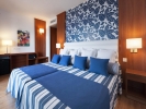 Кровать или кровати в номере Hotel Tahití Playa