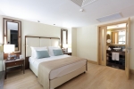 Кровать или кровати в номере Amara Premier Palace Hotel