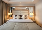 Кровать или кровати в номере Korumar Ephesus Beach & Spa Resort - Ultra All Inclusive