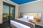 Кровать или кровати в номере Park Inn by Radisson Abu Dhabi Yas Island