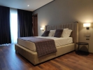 Кровать или кровати в номере Supreme Hotel & Spa