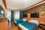 Кровать или кровати в номере Armas Kaplan Paradise