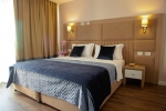 Кровать или кровати в номере Royal G Hotel and Spa