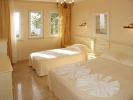 Кровать или кровати в номере Goldcity Hotel