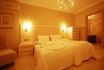 Кровать или кровати в номере Goldcity Hotel