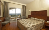 Кровать или кровати в номере Amelia Beach Resort Hotel - All Inclusive